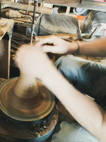 Pottery being formed by hand at ISSUI POTTERY in Okinawa
